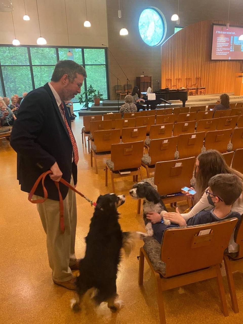 The Rev. James Kubal-Komoto and Yakumo greet the congregation at the blessing of the animals service at Unitarian-Universalist Fellowship of Raleigh