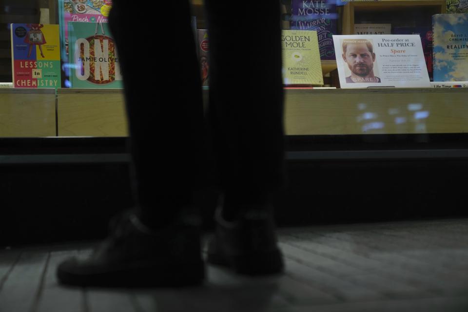 A promotional poster of the new book "Spare"is displayed in a bookstore in London, Thursday, Jan. 5, 2023. Prince Harry alleges in a much-anticipated new memoir that his brother Prince William lashed out and physically attacked him during a furious argument over the brothers' deteriorating relationship, The Guardian reported Thursday. The newspaper said it obtained an advance copy of the book, "Spare," due to be published next week. (AP Photo/Kin Cheung)