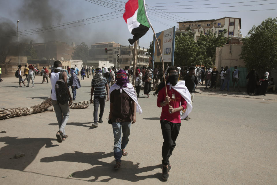 Sudanese demonstrators attend rally to demand the return to civilian rule nearly a year after a military coup led by General Abdel Fattah al-Burhan, in Khartoum, Sudan, Tuesday, Oct. 25, 2022. (AP Photo/Marwan Ali)