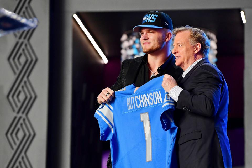 Michigan defensive end Aidan Hutchinson with NFL commissioner Roger Goodell after being selected as the second overall pick to the Lions the during the first round of the NFL draft on Thursday, April 28, 2022, in Las Vegas.