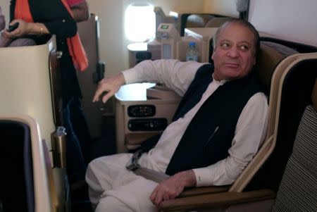 Ousted Pakistani Prime Minister Nawaz Sharif sits on a plane after landing at the Allama Iqbal International Airport in Lahore, Pakistan, July 13, 2018. REUTERS/ Drazen Jorgic