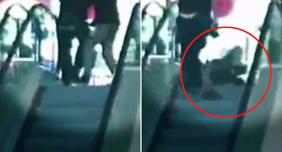 A staff member and a shopper wrestle at an escalator at the entrance of Dymocks in Melbourne. The staff member tumbles and falls on the escalator.