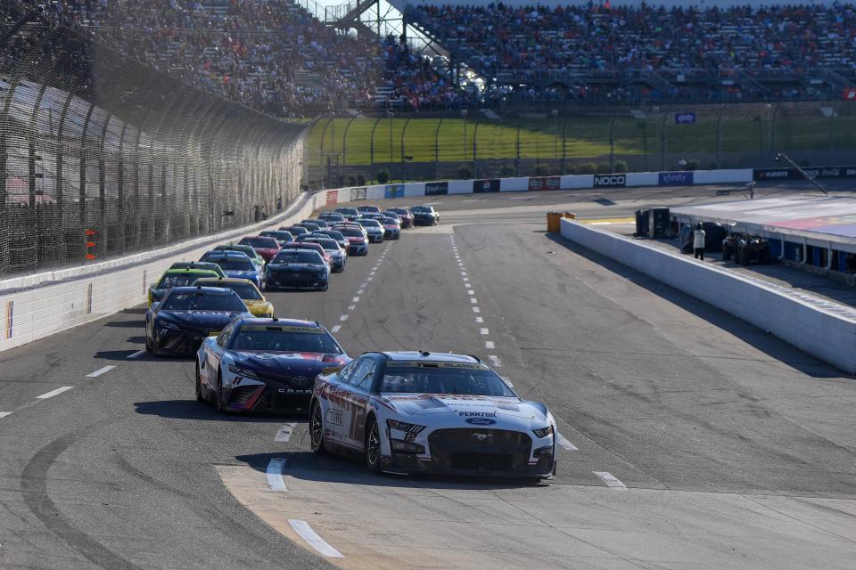 Ryan Blaney (12) leads the field during the Xfinity 500 NASCAR Cup Series playoff race at Martinsville Speedway.