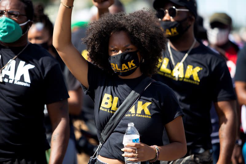 FILE PHOTO: People protest after a Black man identified as Jacob Blake was shot several times by police in Kenosha