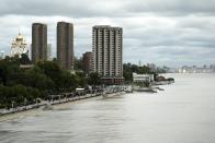 Buildings stand near the Amur River in Khabarovsk, Russia, a city in the country's Far East, Sunday, Sept. 12, 2021. The results of parliamentary and local elections that wrap up on Sunday, Sept. 19, 2021, will be closely watched to gauge how much anger against the Kremlin remains in the region, where its popular governor was arrested last year, causing mass protests. (AP Photo/Daniel Kozin)
