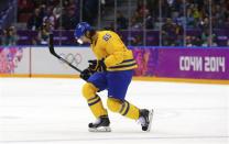 Sweden's Erik Karlsson celebrates his goal against Finland during the second period of their men's play-off semi-final ice hockey game at the Sochi 2014 Winter Olympic Games, February 21, 2014. REUTERS/Mark Blinch