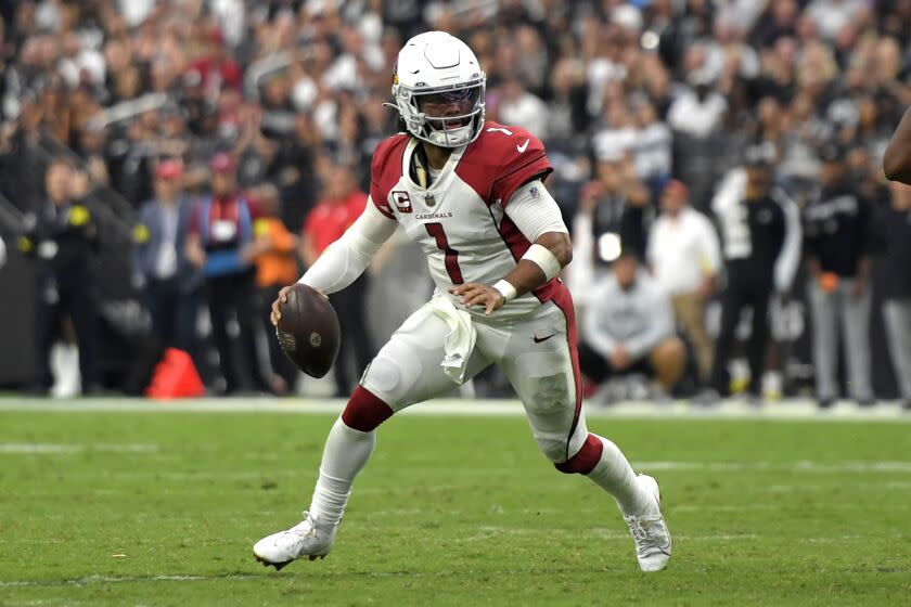 Arizona Cardinals quarterback Kyler Murray (1) scrambles with the ball against the Las Vegas Raiders.