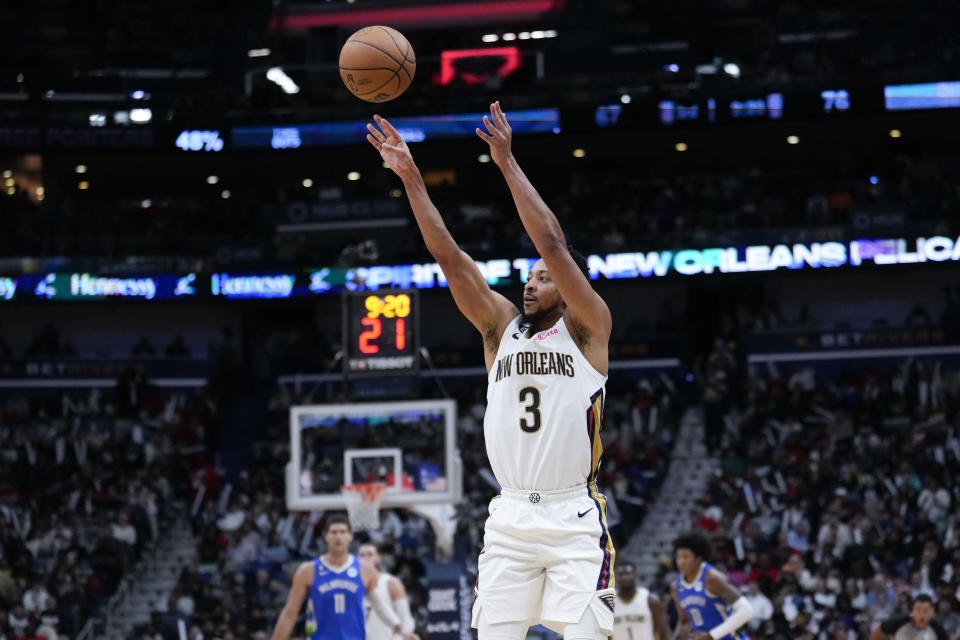 New Orleans Pelicans guard CJ McCollum (3) shoots a 3-point shot in the second half of an NBA basketball game against the Milwaukee Bucks in New Orleans, Monday, Dec. 19, 2022. The Bucks won 128-119. (AP Photo/Gerald Herbert)