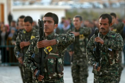 Members of the US-backed SDF attend a funeral on November 6, 2018 for a fellow fighter killed in battle against the Islamic State group