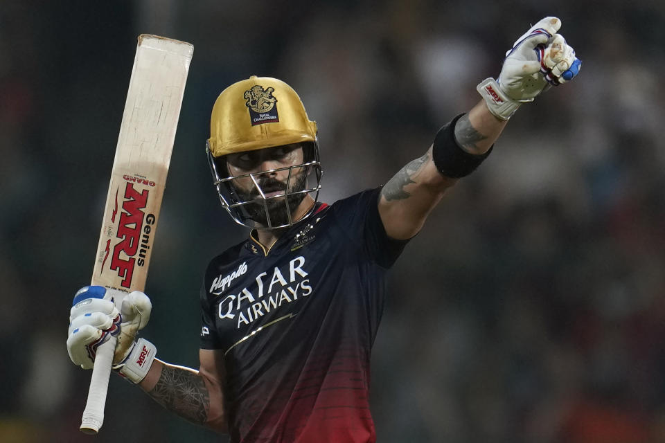 Royal Challengers Bangalore's Virat Kohli celebrates his century during the Indian Premier League cricket match between Royal Challengers Bangalore and Gujarat Titans in Bengaluru, India, Sunday, May 21, 2023. (AP Photo /Aijaz Rahi)