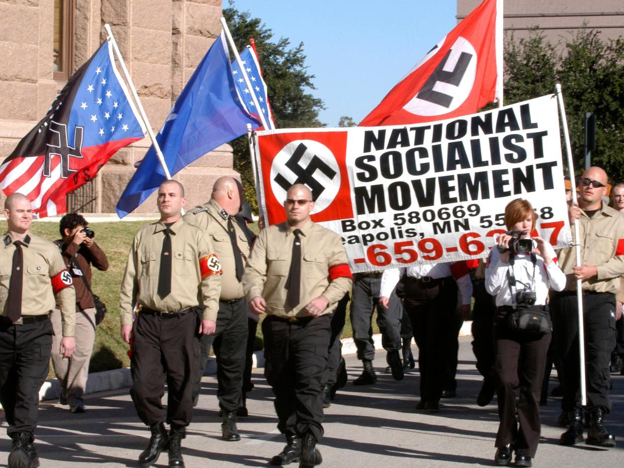 Members of the Minneapolis chapter of the National socialist Movement march outside the Texas State Capitol in Austin, Texas, November 11, 2006
