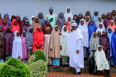 Nigeria's President Muhammadu Buhari meets with some of the newly released Dapchi schoolgirls in Abuja, Nigeria March 23, 2018. Nigeria Presidency/Handout via Reuters