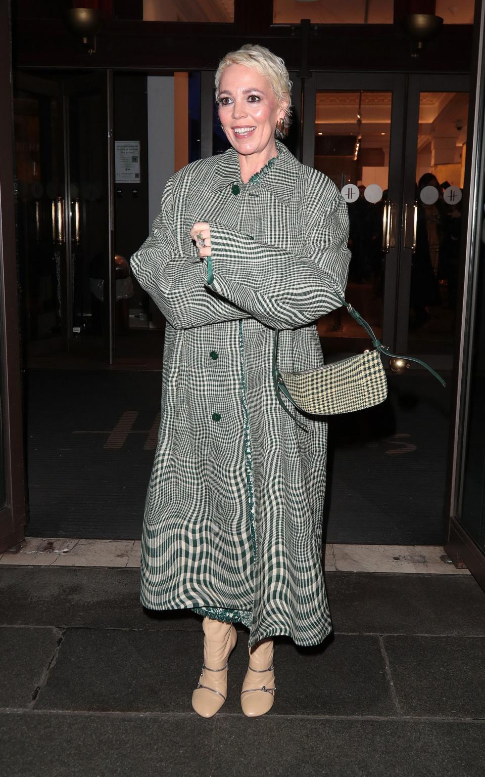 Olivia Colman wearing a Burberry distorted-check coat