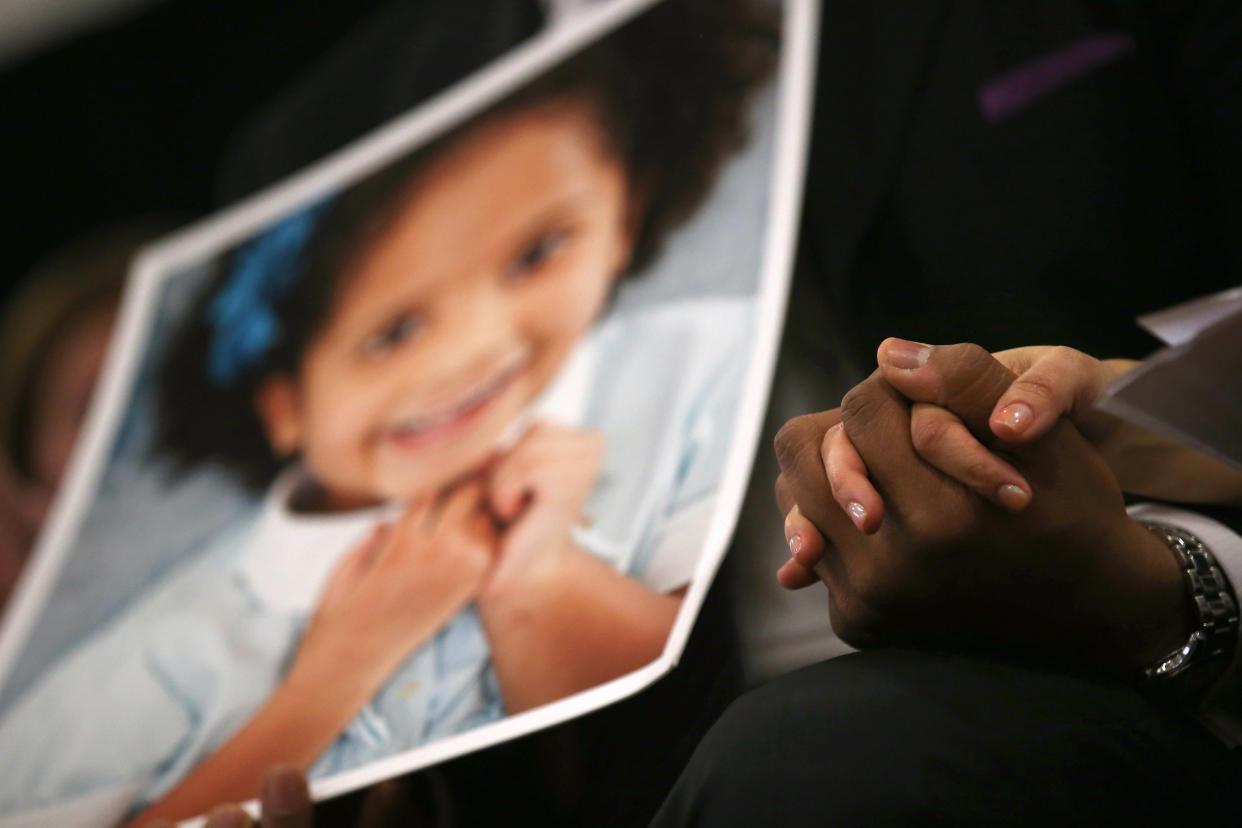 NEWTOWN, CT - JANUARY 14:  Nelba Marquez Greene and her husband Jimmy Green whose daughter Ana Grace Marquez Green (age 6 in photo), was killed in the Sandy Hook massacre, hold hands during a press conference on the one month anniversary of the Newtown elementary school massacre on January 14, 2013 in Newtown, Connecticut. Eleven families of Sandy Hook massacre victims came to the event one month after the shooting to give their support to Sandy Hook Promise, a new non-profit with the goal of preventing such tragedies in the future.  (Photo by John Moore/Getty Images)
