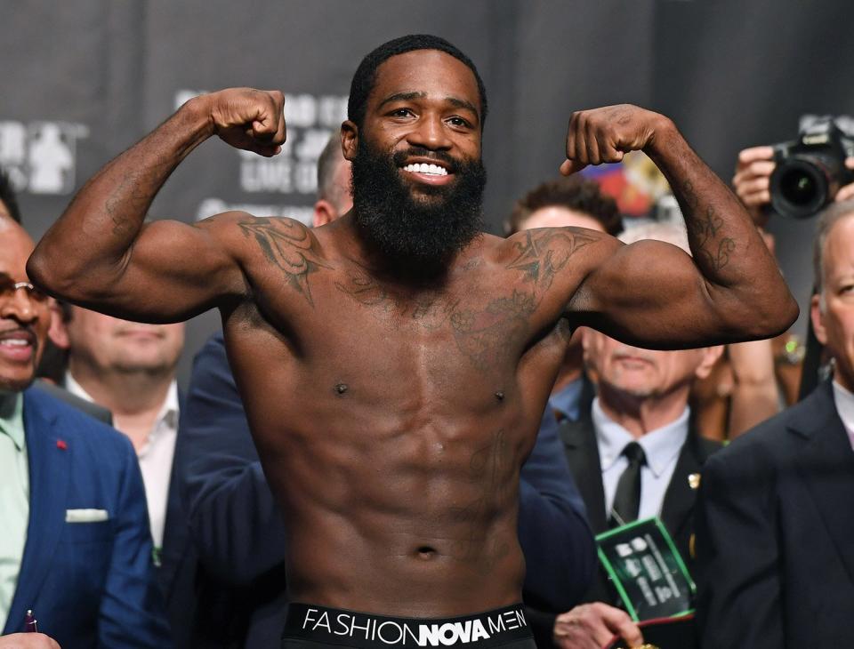 Adrien Broner poses on the scale during his official weigh-in at MGM Grand Garden Arena