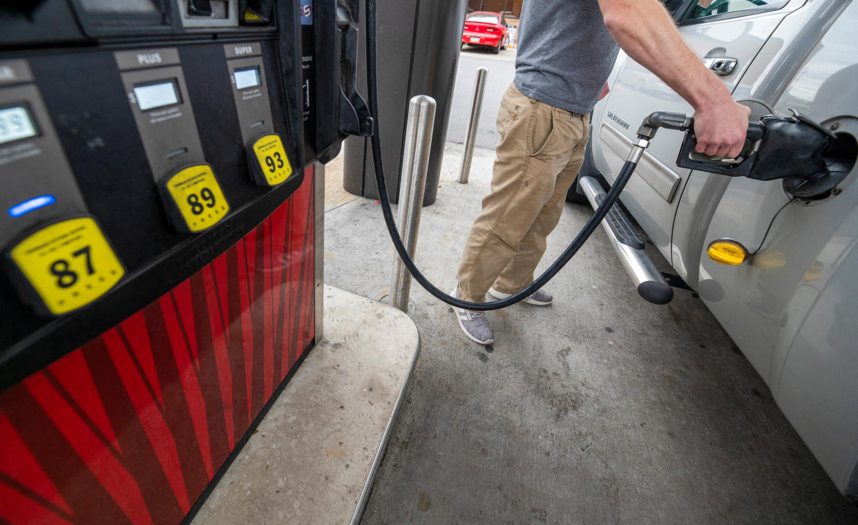 A Sheetz customer gets gasoline at a gas station in Plains, Pennsylvania, U.S. October 19, 2022.  REUTERS/Aimee Dilger