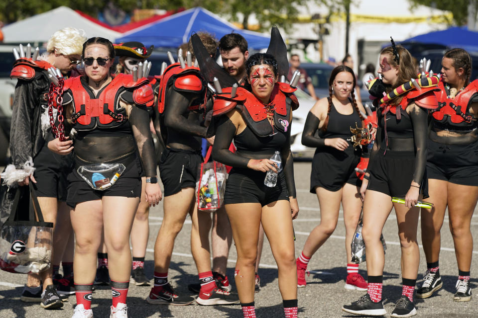 Georgia fans arrive at the stadium before an NCAA college football game between Florida and Georgia, Saturday, Oct. 28, 2023, in Jacksonville, Fla. (AP Photo/John Raoux)