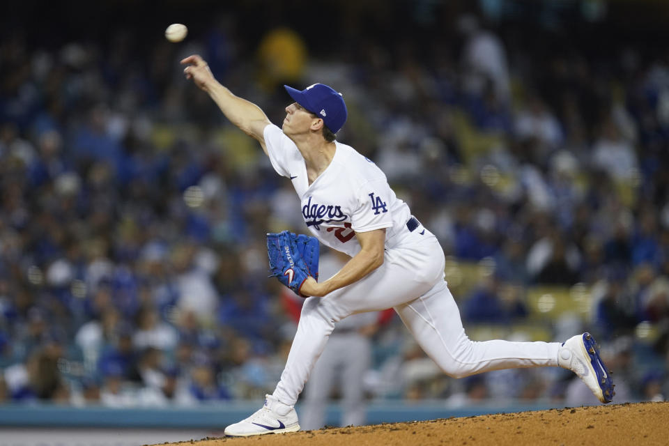 Los Angeles Dodgers starting pitcher Walker Buehler (21) throws during the first inning of a baseball game against the Cincinnati Reds in Los Angeles, Thursday, April 14, 2022. (AP Photo/Ashley Landis)
