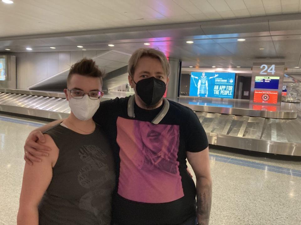 Quinn Reid, left, and Zach Upton at Harry Reid International Airport plan to continue wearing masks on planes.