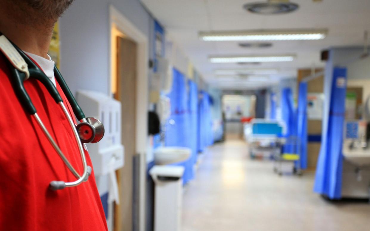 A nurse on a ward at a hospital - PA