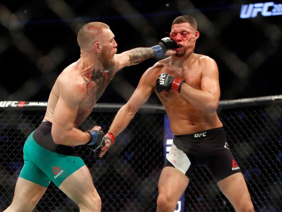 His famous left-hand counter in action, against Nate Diaz at UFC 202 (Getty)