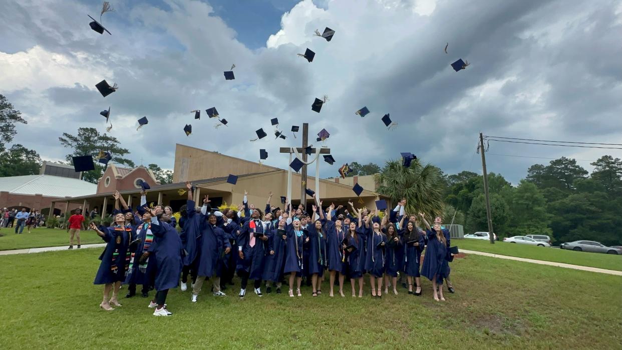 The St. John Paul II Class of 2023 celebrates after graduation on May 21, 2023.