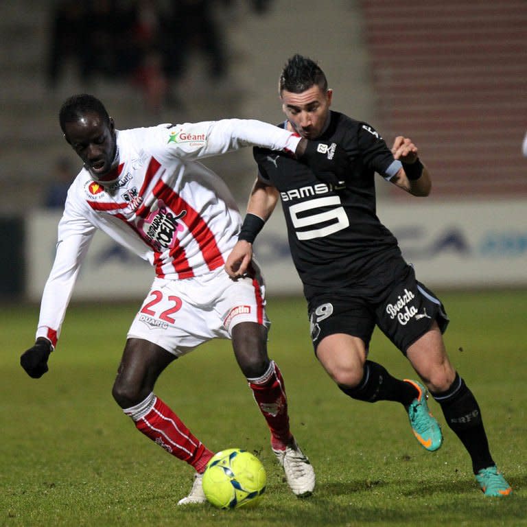 Ajaccio's defender Fousseni Diawara (L) fights for the ball with Rennes' forward Mevlut Erding during their French L1 football match at the Francois Coty stadium in Ajaccio, on the French mediterranean island of Corsica, on December 22, 2012. Rennes are fourth after a 4-2 win at Ajaccio