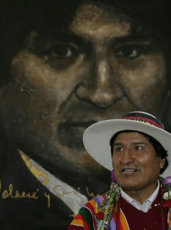 Bolivia's President Evo Morales poses in front of a painting of himself after the inauguration of the Orinoca Museum in Orinoca, Bolivia February 2, 2017. REUTERS/David Mercado