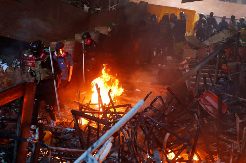 Protesters clash with riot police in the campus of Hong Kong Polytechnic University in Hong Kong