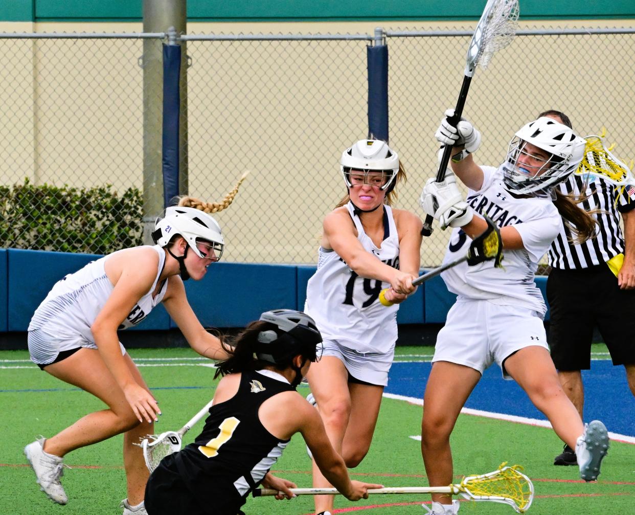 American Heritage-Plantation's Zoe Horwitz forces a save from Ashley Egbert during a regional semi-final game against American Heritage-Delray on April 30, 2024.