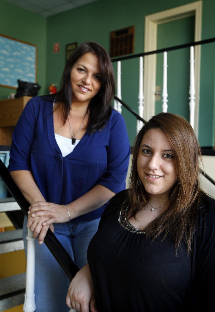 In this March 30, 2012, photo, Makenzie Emerson, 19, right, and her mother, Phyllis Ferraro, 46, both of East Islip, N.Y., pose for a photograph, at Daytop Suffolk Outreach center in Huntington Station, N.Y. Emerson had developed an addiction to pain killers and has recently completed treatment at the center. Sales of the nation’s two most popular prescription painkillers have exploded in new parts of the country, an Associated Press analysis shows, worrying experts who say the push to relieve patients’ suffering is spawning an addiction epidemic. From New York’s Staten Island to Santa Fe, N.M., Drug Enforcement Administration figures show dramatic rises between 2000 and 2010 in the distribution of oxycodone, the key ingredient in OxyContin, Percocet and Percodan. (AP Photo/John Dunn)