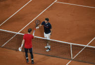 Britain's Andy Murray congratulates Switzerland's Stan Wawrinka after Murray lost in three sets 1-6, 3-6, 2-6, in the first round match of the French Open tennis tournament at the Roland Garros stadium in Paris, France, Sunday, Sept. 27, 2020. (AP Photo/Christophe Ena)