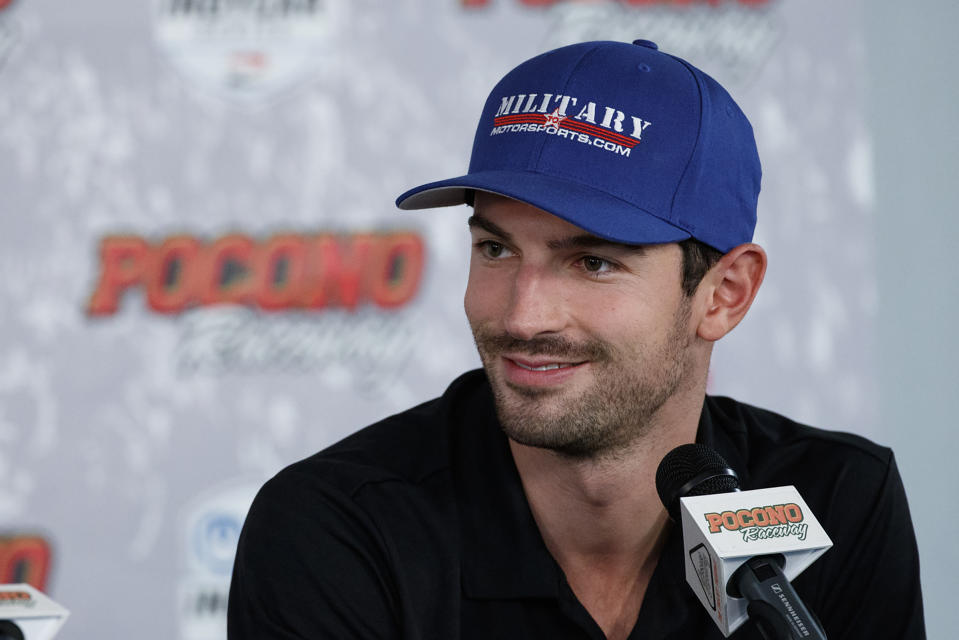 FILE - In this Aug. 17, 2019, file photo, Alexander Rossi smiles during a news conference for an IndyCar Series auto race at Pocono Raceway, in Long Pond, Pa. Josef Newgarden leads Rossi in the IndyCar standings heading into this weekend's finale at Laguna Seca Raceway in Monterey, Calif. (AP Photo/Matt Slocum, File)