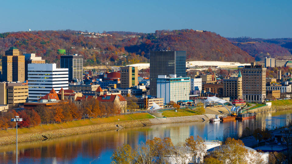 Charleston, West Virginia elevated skyline view (during Autumn), with hills and the Kanawha River included in the view.