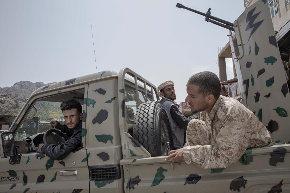 In this Monday, Aug. 5, 2019 photo, fighters from a militia known as the Security Belt, that is funded and armed by the United Arab Emirates, head to their training camp, in an area called Moreys, in Yemen's Dhale province. Yemen’s civil war has been deadlocked for months, with neither side making major gains. At one of the most active front lines, militiamen backed by the Saudi-led coalition are dug in, exchanging shelling every night with Iranian-allied Houthi rebels only a few hundred meters away. (AP Photo/Nariman El-Mofty)