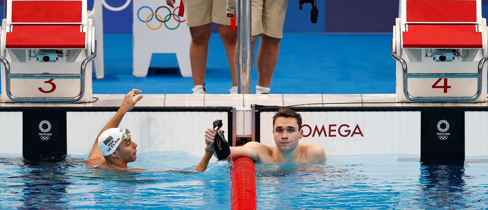 Kristof Milak of Hungary R and Chad le Clos of South Africa react after the men's 200m butterfly final of swimming at Tokyo 2020 Olympic Games in Tokyo, Japan, July 28, 2021. (Photo by Wang Lili/Xinhua via Getty Images)