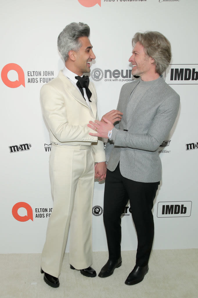 the couple looks adoringly at each other at a red carpet event