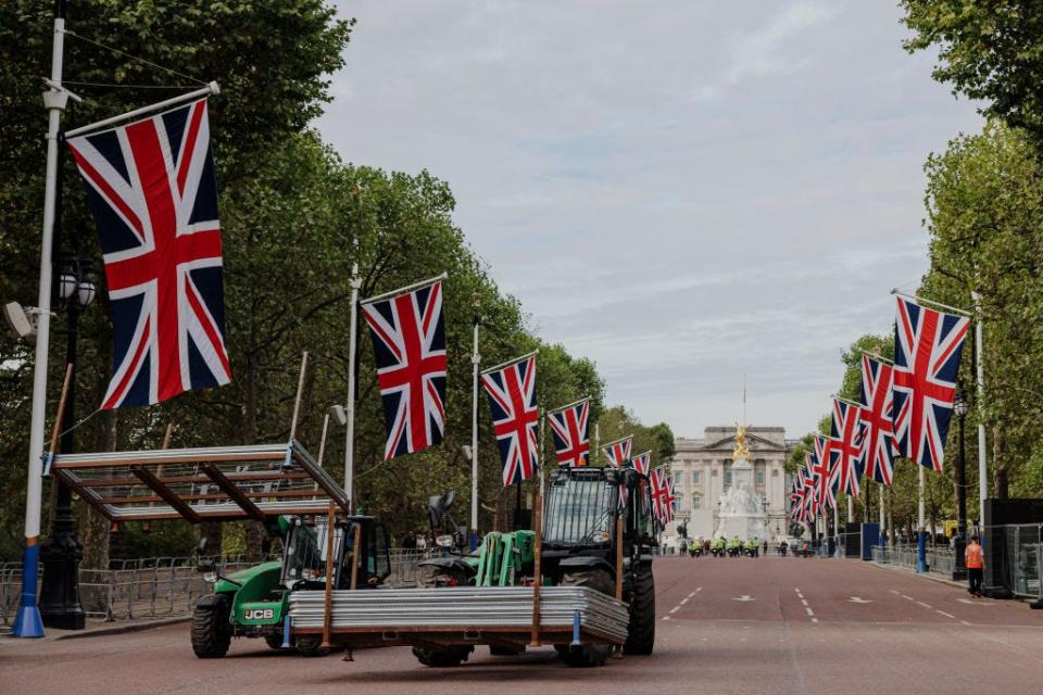 A forklift truck clears away fencing on The Mall after Queen Elizabeth's funeral