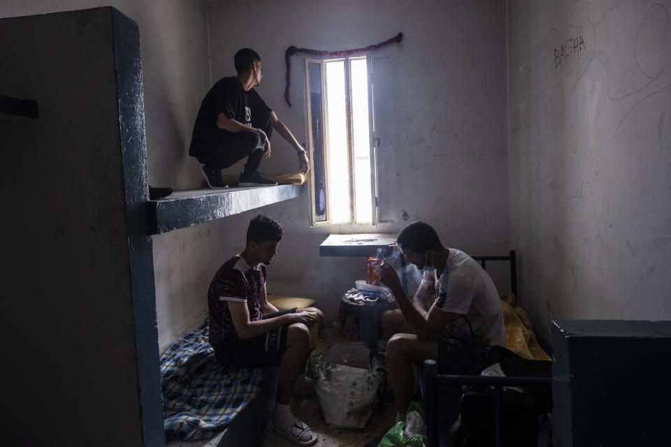 Migrants take shelter inside an abandoned building in the Spanish enclave of Ceuta, Friday, May 21, 2021. (AP Photo/Bernat Armangue)