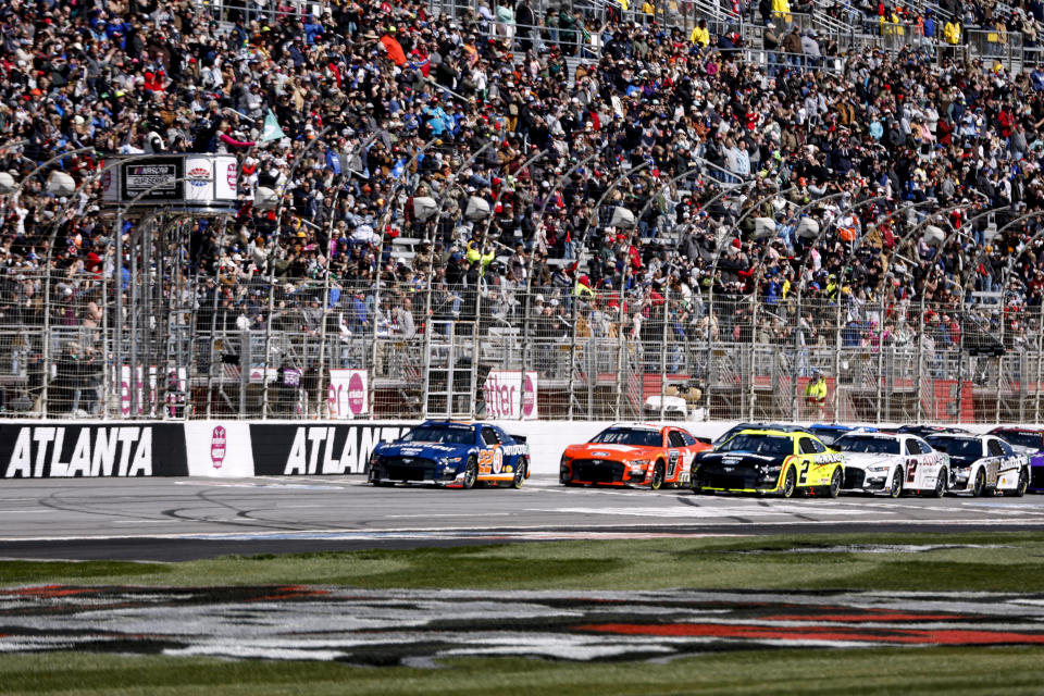 NASCAR Cup Series driver Joey Logano (22) leads the back to start the Ambetter Health 400 auto race at Atlanta Motor Speedway, Sunday, March 19, 2023, in Hampton, Ga. (AP Photo/Butch Dill)