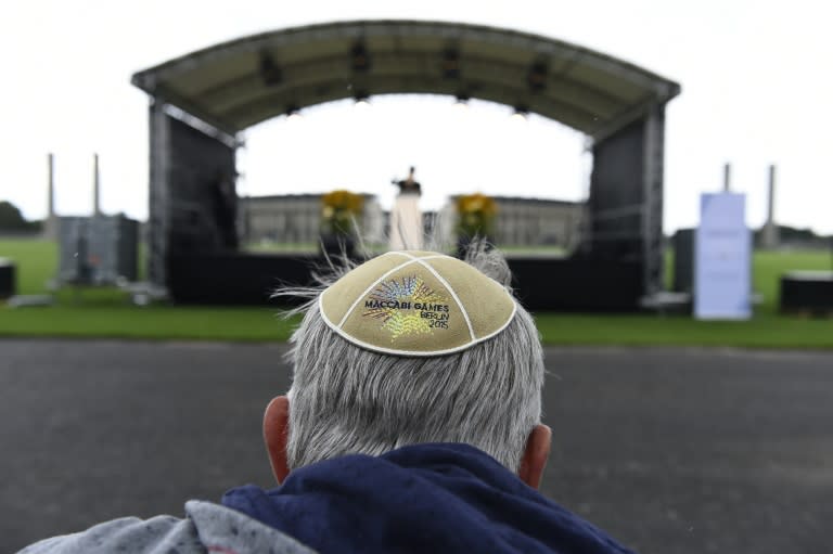 A man wears a Kippa at the so-called "Maifeld" near the Olympic Stadium of Berlin, during a Memorial ceremony for the victims of the Holocaust before the official opening ceremony of the 14th European Maccabi Games in Berlin, on July 28, 2015