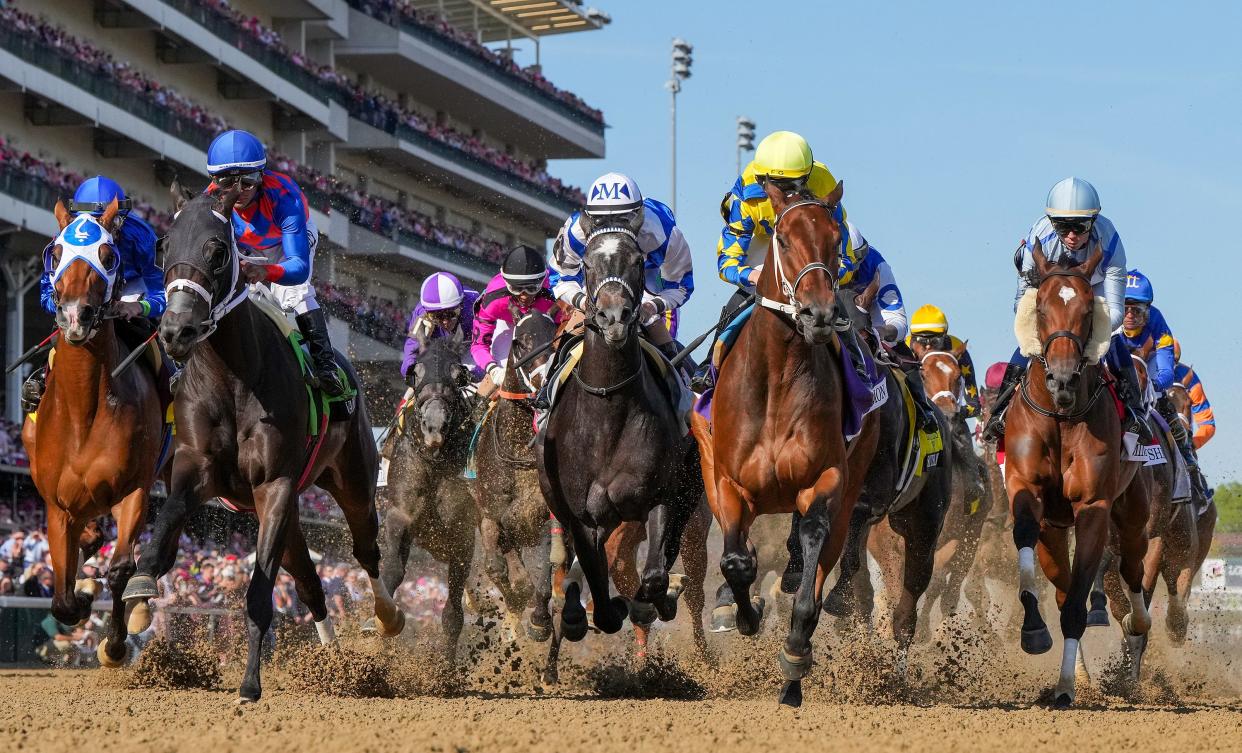 The field for the 149th Running of the Kentucky Oak makes their way past the grandstands at Churchill Downs on May 5, 2023