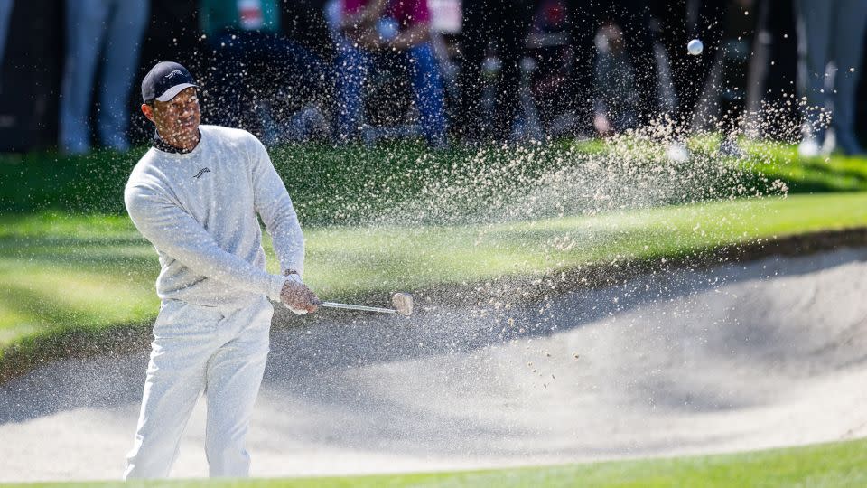 Woods hits from a bunker on the 10th hole during the first round of the Genesis Invitational. - Jason Parkhurst/USA TODAY Sports/Reuters