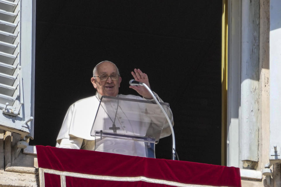 Pope Francis appears at the window of his studio overlooking St. Peter's Square at The Vatican for the traditional Sunday noon blessing of faithful and pilgrims gathered in the Square for the Angelus prayer, Sunday, Feb. 25, 2024. Pope Francis had canceled an audience scheduled for Saturday as a precaution after coming down with mild flu, the Vatican press office said in a short statement, without adding further details. (AP Photo/Gregorio Borgia)