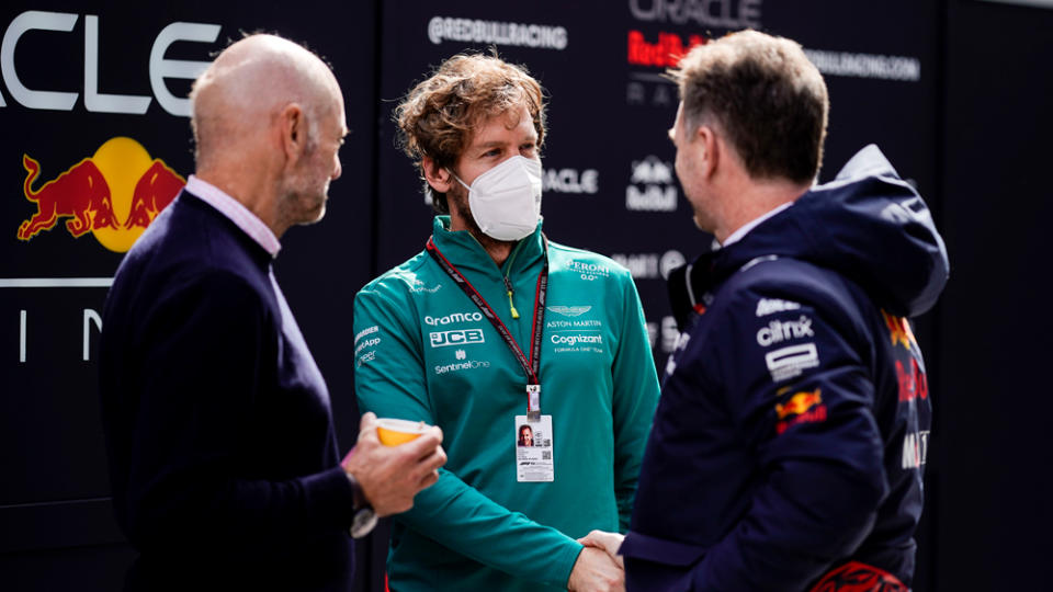 Red Bull Racing’s Adrian Newey and Christian Horner (left and right, respectively) greet Formula 1 racer Sebastian Vettel (middle) during 2022 pre-season testing. - Credit: James Gasperotti/ZUMA Press Wire/Cal Sport Media via AP Images