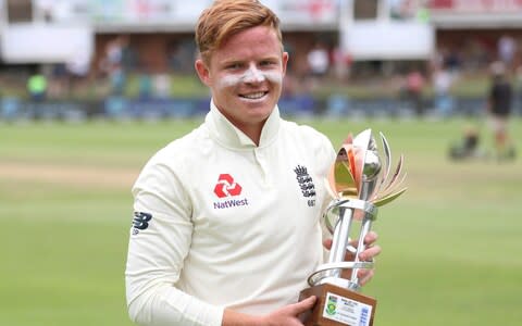 Ollie Pope poses with the man of the match trophy at St George's Park, Port Elizabeth - Credit: Reuters