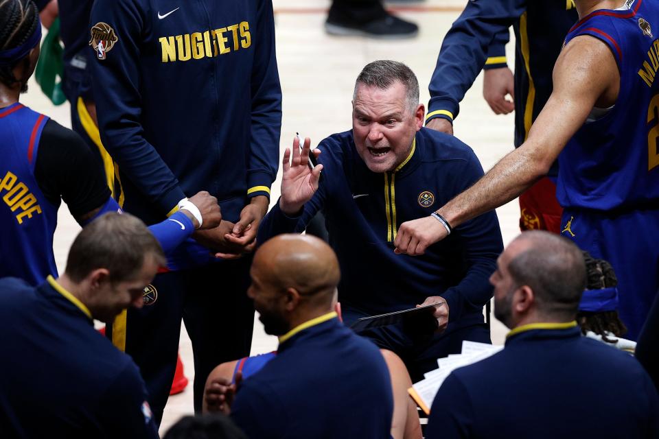 Game 1: Denver Nuggets head coach Michael Malone speaks to his team during a timeout during the first quarter.