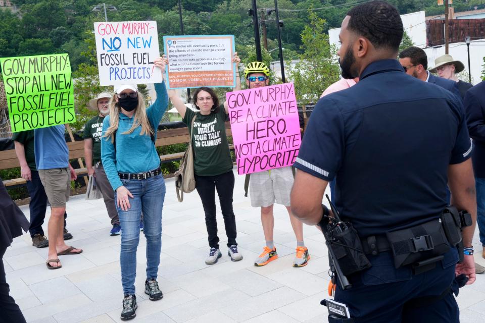 Climate protestors shouted at Governor Murphy (not shown) as he spoke in Hoboken during the grand opening for the ResilienCity Park. Monday, June 12, 2023