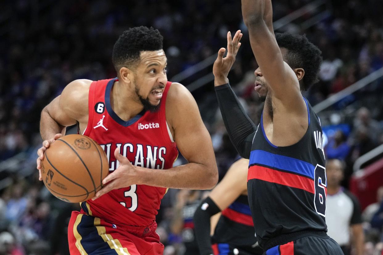New Orleans Pelicans guard CJ McCollum (3) drives on Detroit Pistons guard Hamidou Diallo (6) in the second half of an NBA basketball game in Detroit, Friday, Jan. 13, 2023.