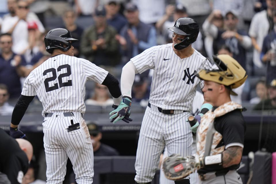 New York Yankees' Juan Soto, left, celebrates with Aaron Judge after hitting a home run during the first inning of a baseball game against the Chicago White Sox, Saturday, May 18, 2024, in New York. (AP Photo/Frank Franklin II)